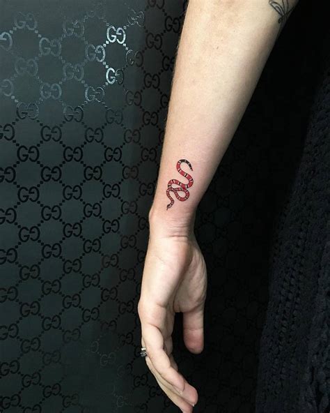 gucci snake finger tattoo|snake tattoo gucci.